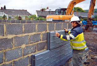A building installing EPS expanded polystyrene airpop blocks in a building wall
